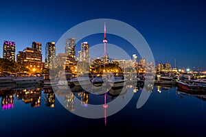 Toronto city skyline at Night fromÂ Marina Quay West, Ontario, Canada